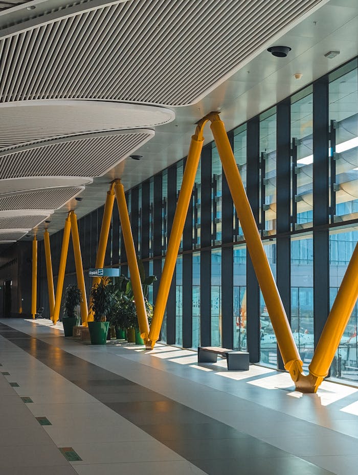 services-02 A sleek and modern interior view featuring yellow structural beams and large windows in Istanbul.